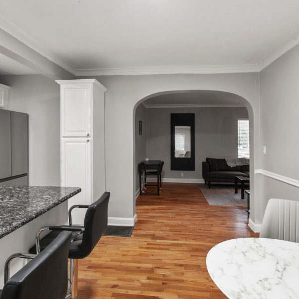 modern interior of a white apartment with open floor layout long